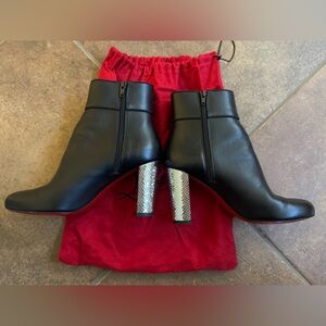 Christian Louboutin black leather boots with shiny heel